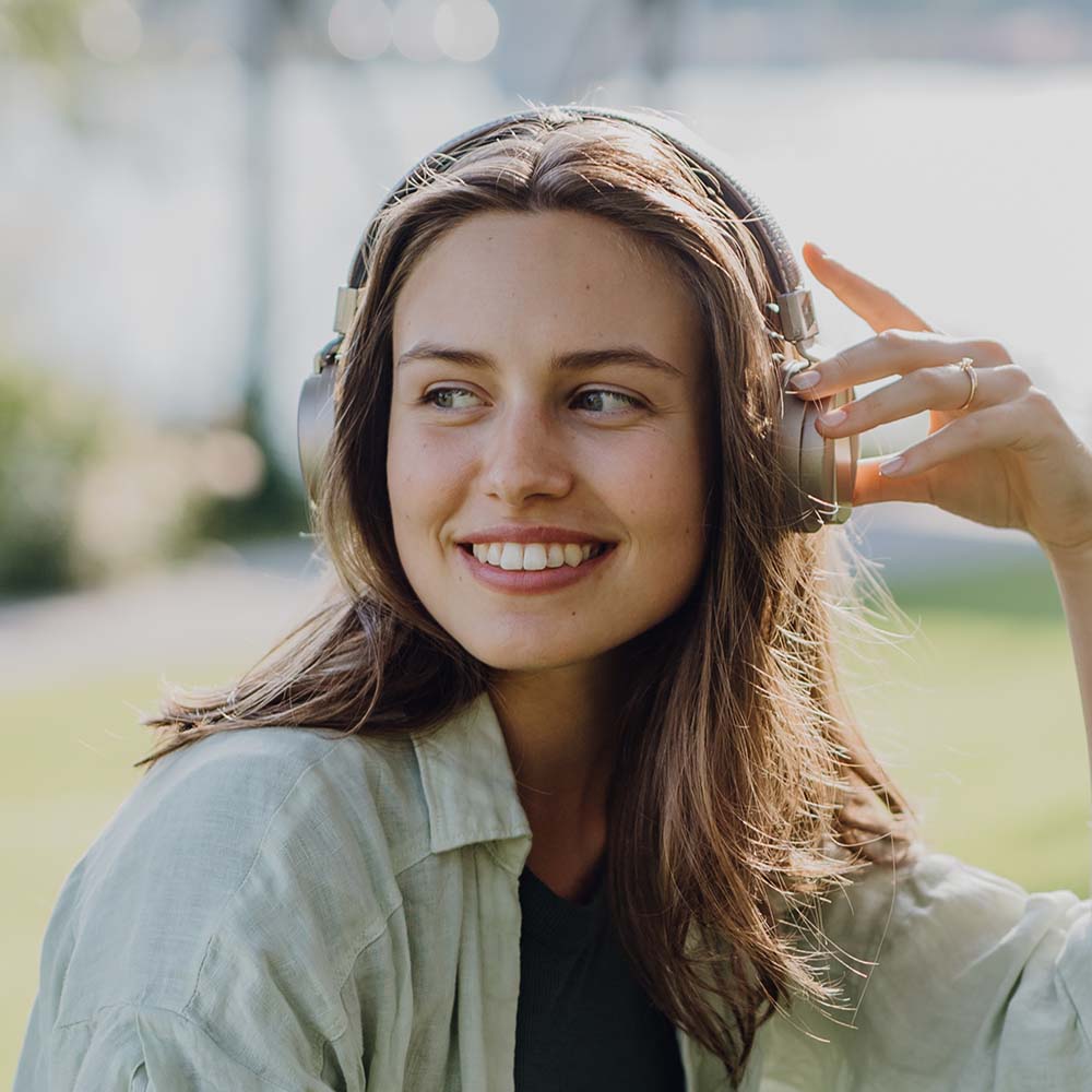 Home 12 portrait of young woman listening music trough hea 4PDXGCW